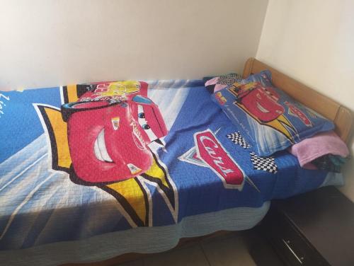 a bed with two backpacks on top of it at Habitación acogedora en Chapinero in Bogotá