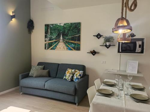 a living room with a couch and a table at Vivila - Al Lucernario in Cernusco sul Naviglio