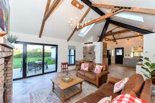a living room with a couch and a table at Bramble Cottage, hidden gem in Comber near Belfast in Comber