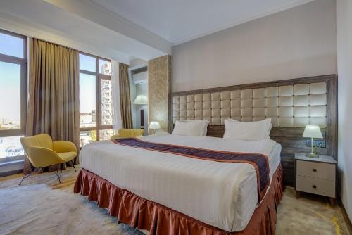 Postel nebo postele na pokoji v ubytování Hotel Lulu