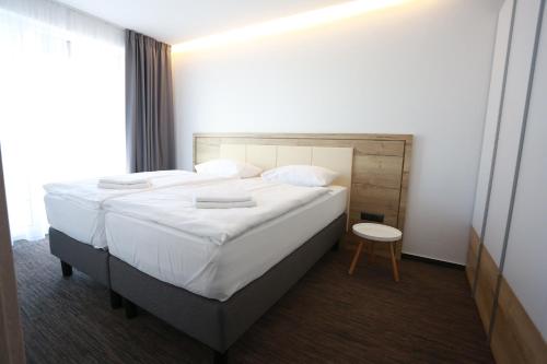 Postel nebo postele na pokoji v ubytování Apartment Senec pri Aquaparku