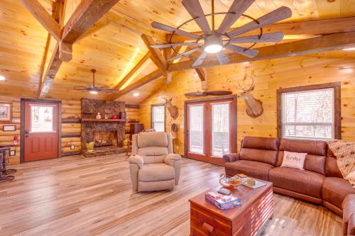a living room with a couch and chairs in a cabin at Pet-Friendly Chattanooga Cabin with Hot Tub and Kayaks in Chattanooga