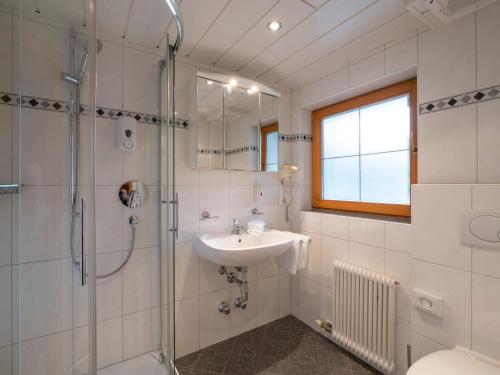 a bathroom with a sink and a shower at Gasthof Mamooserhof in Penning