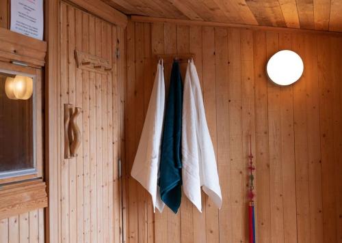 a room with towels hanging on a wall at Cozy Cabin in Stockholms Archipelago in Ingmarsö