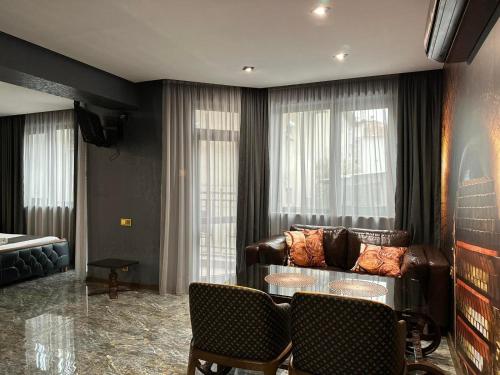 a living room with a couch and a table at HIDDEN BANK: Digger's Dream in Plovdiv