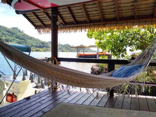 a hammock on the deck of a boat at TAHAA - Fare Motoi in Tiva