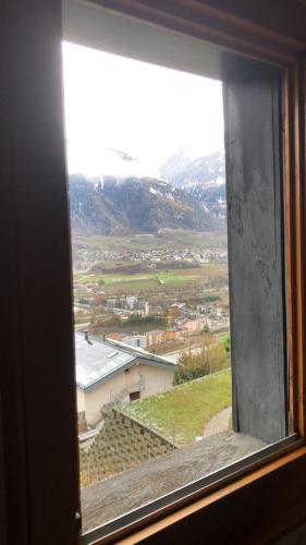 a view from a window of a town at Chalet Crans-Montana in Crans-Montana