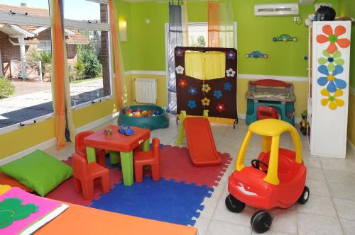 a room with a play room with toys in it at Carilo Soleil By HS in Carilo