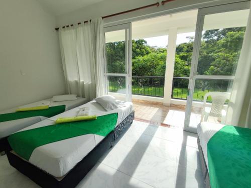 Una cama o camas en una habitación de Hotel Campestre Mastranto
