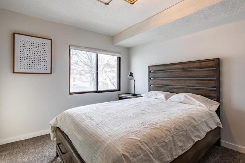 a bedroom with a large bed and a window at Modern 2 Bed/1 Bath, In-Unit Laundry, Parking + 6 Blocks from Mayo in Rochester