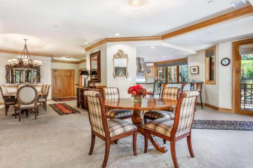 a dining room with a table and chairs at Beaver Creek Lodge 411 in Beaver Creek