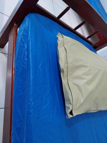 a blue tent with a white pillow on top at POUSADA PERLLA's Pindamonhangaba in Pindamonhangaba