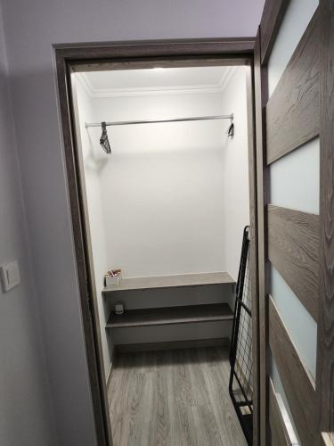 Ένα ή περισσότερα κρεβάτια σε δωμάτιο στο apartament u Irenki