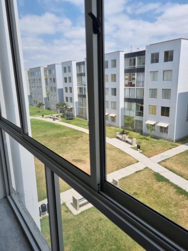 a view from a window of an apartment building at Alquiler de habitación in Piura