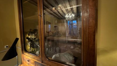 a wooden cabinet with a sink in a room at ZONE BLEUE in Hyds