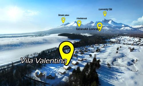 an aerial view of a village in the snow at Vila Valentina in Veľká Lomnica