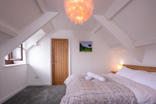 Ένα ή περισσότερα κρεβάτια σε δωμάτιο στο The Snug in Mousehole