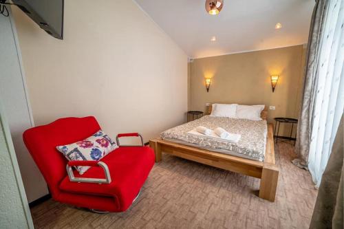 En eller flere senge i et værelse på Pensiunea Sky