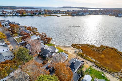 an aerial view of a lake with houses at 154 Pinehurst Dr, Wareham in Wareham