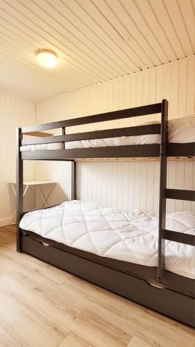 a bedroom with two bunk beds in a room at Chalet La Boverie 195 in Rendeux