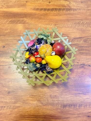 a heart shaped bowl of fruits and vegetables on a table at Exotic 2 BR Apartment at Wuye, Abuja - Wifi,Netflix in Abuja