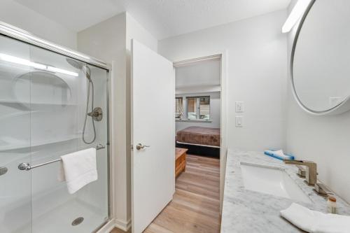 a bathroom with a shower and a sink at Windriver Retreat in Teton Village