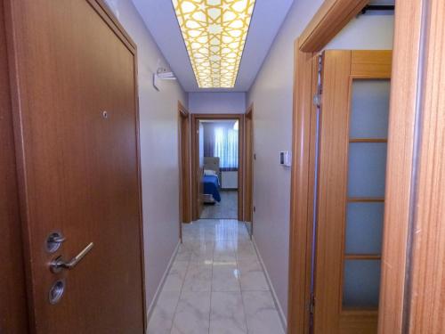 a hallway with a ceiling with a light at Big Historia Apartment in Istanbul