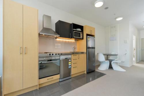 A kitchen or kitchenette at MCentral Apartments Manukau