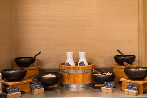a display of bowls of food and bowls of rice at Hotel Du Lac Congress Center & Spa in Ioannina