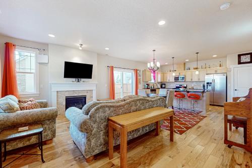 a living room with a couch and a fireplace at Best Catch Casa in Beaverton