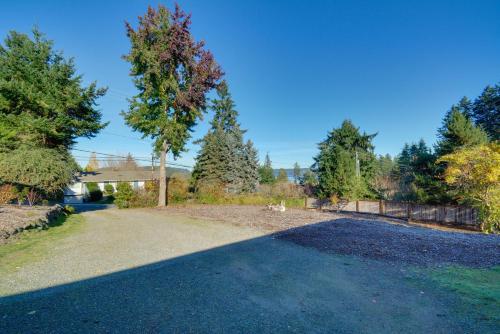 an empty driveway in a yard with trees at Gig Harbor Vacation Rental Home 1 Mi to Uptown! in Gig Harbor