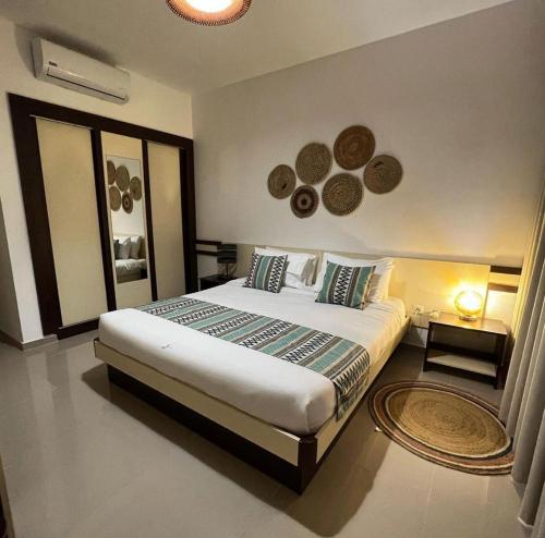 a bedroom with a large bed in a room at Locanda Inn Place in Luanda