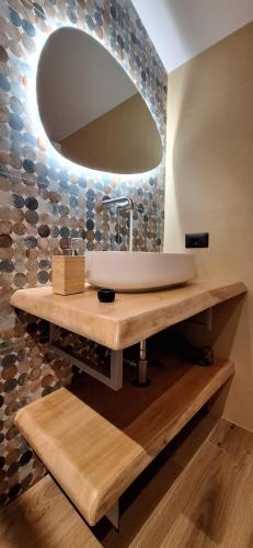 a bathroom with a sink and a mirror at IL RIFUGIO DI GASTONE - Monte Amiata - Macinaie - in Castel del Piano