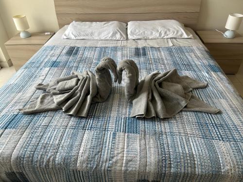 Posteľ alebo postele v izbe v ubytovaní Sunquest court