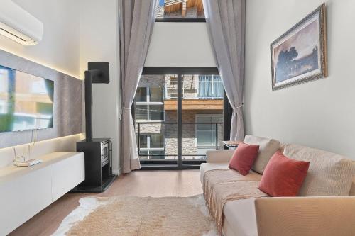 Posezení v ubytování Loft Canela 1 Suíte Centro by Achei