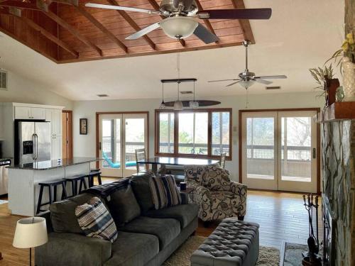 a living room with a couch and a table in it at Entire 3 Bedroom Home in Rumbling Bald Resort in Lake Lure