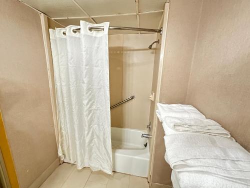 a bathroom with a shower with a shower curtain at Econo Lodge Scranton near Montage Mountain in Scranton