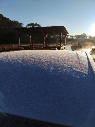 a close up of the hood of a car at Pousada Nó de Pinho in Urubici