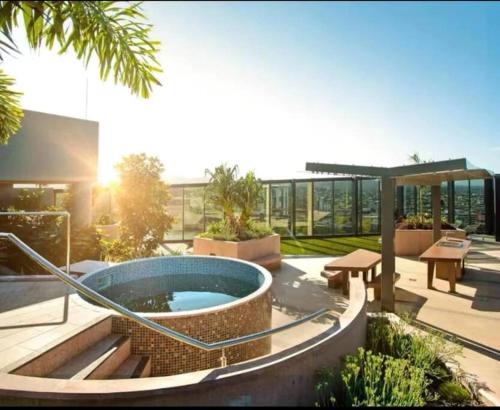 a courtyard with a hot tub in a building at Artistic South Brisbane 2 bedroom Apartment with Parking in Brisbane