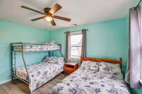 a bedroom with two bunk beds and a ceiling fan at Beach House with Private Pool in North Wildwood in North Wildwood