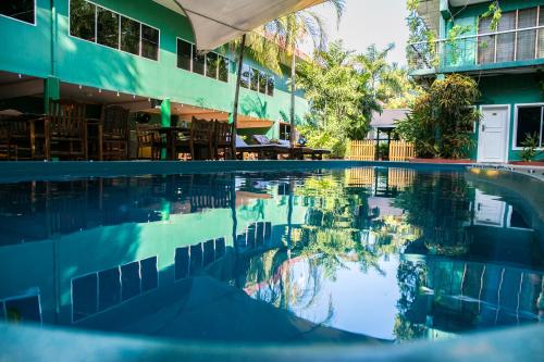 a swimming pool in front of a building at Hideaway Hotel in Port Moresby