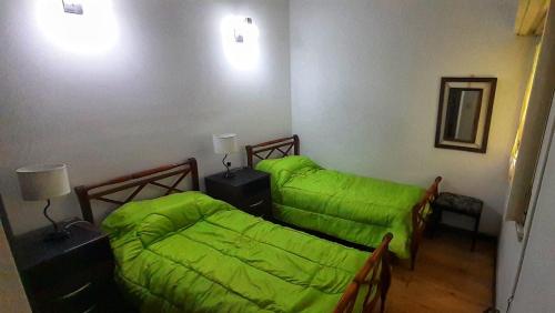 Krevet ili kreveti u jedinici u okviru objekta Alquiler temporario 3 amb Parque Luro Mar del Plata