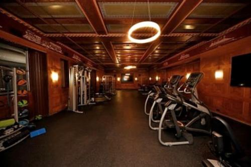 a gym with a row of chairs in a room at Downtown Morado Loft #1, FREE Parking & Skywalk to Lucas Oil & Conv Center in Indianapolis