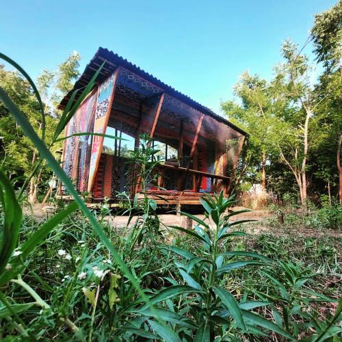 a building in the middle of a forest at Planta Farm - Jungle Stay in Santa Maria Huatulco