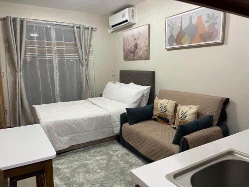 Postel nebo postele na pokoji v ubytování CKK Condo Unit