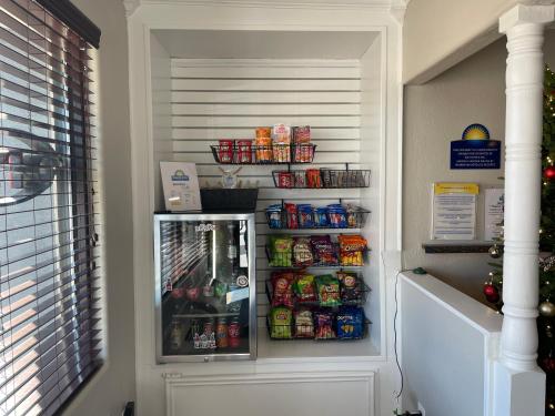 a refrigerator filled with lots of food and soda at Days Inn by Wyndham Temple in Temple