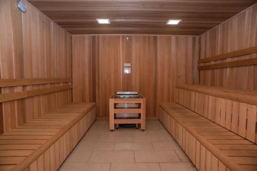 a sauna with wooden shelves and a table in it at Candlewood Suites - Joliet Southwest by IHG in Joliet