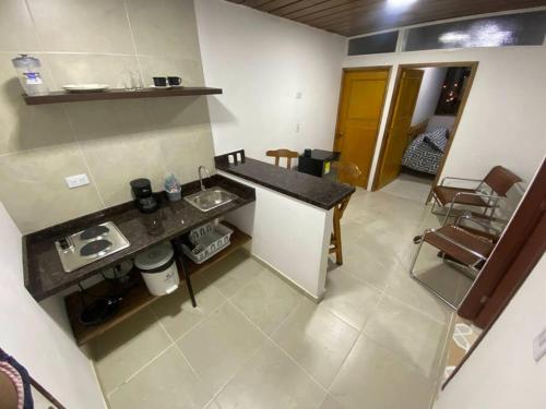 a kitchen with a counter and a sink in a room at Apto - 1802B - Vista Única in Bogotá