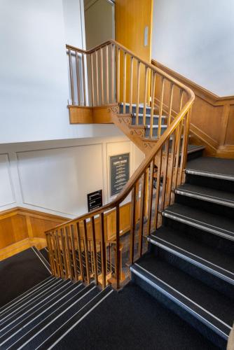 a spiral staircase in a building with a stair case at Nightcap at Rose & Crown Hotel in Elizabeth