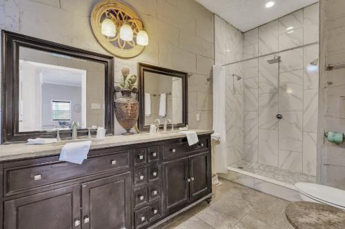 a bathroom with a sink and a shower at Atlantis Inn - Tybee Island in Tybee Island